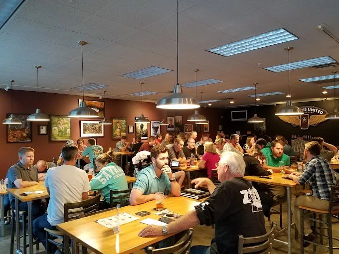 Veterans United taproom interior featuring tap handles and the brewery's award-winning signage